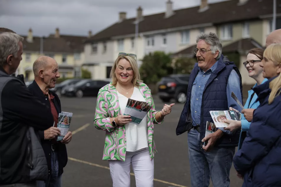 Sandra Duffy holding leaflets in the street